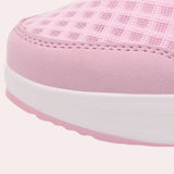 Stylish black slip-on mesh sneakers with air-cushion sole designed for outdoor walking.