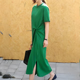 
A stylish green twisted tee featuring a unique knot detail at the front, with short sleeves and a comfortable fit, shown in a 3XL size.