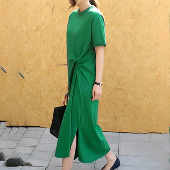 
A stylish green twisted tee featuring a unique knot detail at the front, with short sleeves and a comfortable fit, shown in a 3XL size.