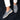 Stylish grey suede men's slip-on loafers on a person's feet, showcasing lightweight casual shoes.