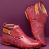 Stylish men's tan slip-on leather ankle boots with a durable design, featuring a sleek red color variant in size 43.