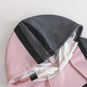Stylish two-tone grey faux leather backpack with reflective stripes, featuring a comfortable design and fashion-forward pattern.