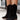Stylish black women's perforated Western ankle cowboy boots with a pointed toe and low heel, showcasing a fashion-forward design.