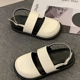 Stylish women's black platform orthopedic sandals with an ankle strap, featuring a sleek black design and platform sole for added comfort and support.