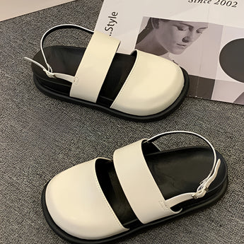 Stylish women's black platform orthopedic sandals with an ankle strap, featuring a sleek black design and platform sole for added comfort and support.