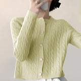 Stylish women's black quilted bomber jacket with gold button detail, featuring a high collar and long sleeves, displayed on a mannequin showcasing its elegant design and fit.
