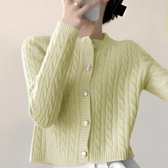 Stylish women's black quilted bomber jacket with gold button detail, featuring a high collar and long sleeves, displayed on a mannequin showcasing its elegant design and fit.