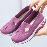 Stylish women's black slip-on sneakers in size 42 with a purple accent, designed for lightweight and breathable comfort, made with synthetic rubber material suitable for outdoor activities and walking.