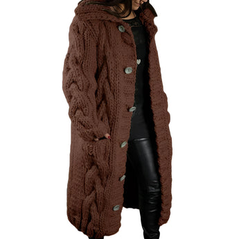 A beige chunky knit cardigan for women, featuring long sleeves and a cozy, oversized fit. The cardigan is styled with a collared design, offering a warm and fashionable winter look.