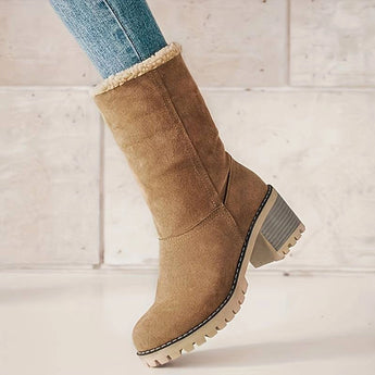 Stylish tan suede winter boots for women with shearling lining, showcasing a fashionable design and sturdy construction.