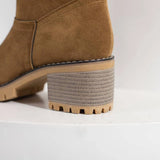 Tan suede winter boots for women with shearling lining, featuring a stylish design perfect for cold weather comfort.
