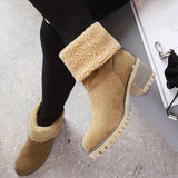 Stylish women's tan suede winter boots with shearling lining, shown in camel color and size 42, featuring a cozy leg fit and fashionable design.