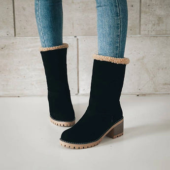 Stylish women's black suede winter boots with shearling lining, featuring a sleek design ideal for cold weather fashion.