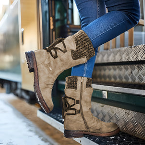 Brown stylish women's suede waterproof winter boots with a knitted cuff, shown on a foot, emphasizing the insulated design suitable for cold weather.