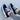Stylish women's white sneakers with a vibrant red sole, shown in a navy blue variant, size 43, designed for trendy urban fashion.