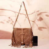 Tan suede crossbody bag with fringe tassels and a boho design, featuring a shoulder strap and hobo bag style suitable for festivals.