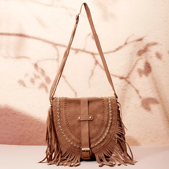 Tan suede crossbody bag with fringe tassels, featuring a boho style ideal for festivals.
