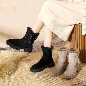 Suede fur-lined women's ankle boots designed for winter, featuring a warm interior and slip-resistant soles, shown worn with leggings.
