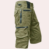 Men's light green tactical cargo pants in 3XL, featuring multiple pockets and zippers, designed for outdoor use.