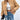 Tan corduroy bomber jacket for women displayed on a model wearing casual jeans and a dress shirt. The jacket features a trendy fall design with a relaxed fit, showcasing details like long sleeves and a high neckline. Its beige color and textured fabric make it a stylish choice for outerwear.
