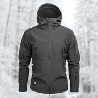Gray tactical hoodie with a soft-shell, water-resistant design, featuring a military-grade construction. The hoodie includes elements such as a collar, long sleeves, and a comfortable fit, displayed on a human model.