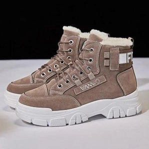 Taupe fur-lined winter boots with chunky sole and lace-up design, featuring a grey and beige color scheme, suitable for outdoor activities.