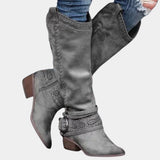 Taupe suede knee-high boots with a Western-inspired design featuring a studded heel and side zipper, shown in gray color, size 42.