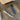 Taupe suede men's slip-on loafers on a hardwood floor, featuring a versatile and comfortable design in blue, size 47.