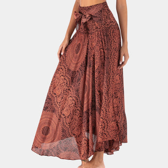 A women's summer skirt in teal with a bohemian floral lace design, styled in an A-line cut.
