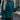 
Woman wearing a teal cropped sweater with long sleeves and a high neckline, paired with a faux leather mini skirt, styled for fall fashion. The sweater is a rich dark cyan color, and the ensemble is shown in a standing pose highlighting the waistline.
