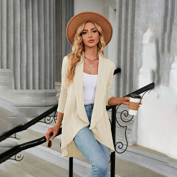 Teal long sleeve knit cardigan styled with jeans and a fashionable fedora hat, perfect for fall layering.