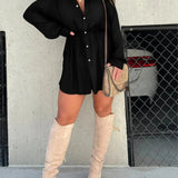 Teal oversized shirt dress paired with thigh-high suede boots, accessorized with sunglasses.