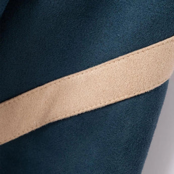 Teal soft fleece jacket with long sleeves and a high collar, designed for premium sustainable outdoor wear.