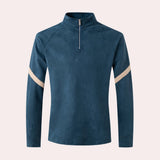 Teal fleece jacket with full sleeves and a high collar, featuring a sustainable design.