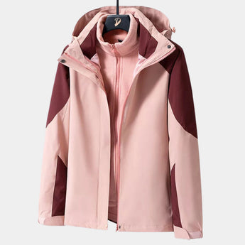 Women's waterproof breathable hiking jacket in pink with long sleeves and a collar, lightweight and windproof design, suitable for outdoor activities.