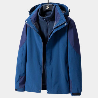Teal women's lightweight and windproof hiking jacket featuring a full-length zipper, long sleeves, and a high collar. It is designed for waterproof and breathable performance in outdoor activities. The jacket is in a bluish hue and is available in a 4XL size.