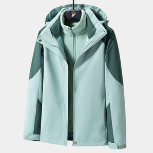 
A teal women's lightweight and windproof hiking jacket with long sleeves, featuring a button-up front and a high collar. The jacket is designed to be waterproof and breathable, suitable for outdoor activities. It is displayed in a 4XL size and has a sleek, fashion-forward design.
