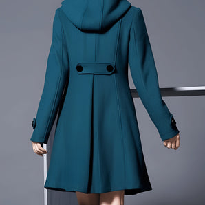 Teal wool coat for women featuring an elegant hood, flare design, and long sleeves, suitable for winter wear.