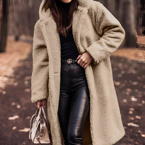 Woman wearing a Teddy Bear Long Beige Oversized Faux Fur Winter Coat in XL, accessorized with sunglasses and styled hair.