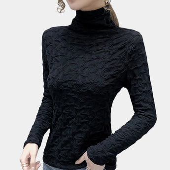 Textured black floral embossed high-collar women's top featuring long sleeves and a fitted waist, displayed against a neutral background.