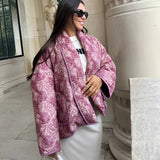 A stylish monochrome purple bomber jacket designed for winter street style, featuring long sleeves, a collar, and a cinched waist, paired with trendy sunglasses for a cool, modern look.