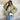 Textured bomber jacket in green patterned design, worn by a person with sunglasses, showcasing a stylish monochrome winter street style with a focus on outerwear fashion.