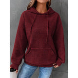 Cozy women's winter pullover in a textured pink waffle knit, featuring a relaxed fit with a hoodie design. The pullover is in the Bordeaux color, available in size 3XL.