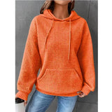 Textured waffle knit hoodie in orange, designed for women in a cozy 3XL size, featuring a comfortable pullover style with long sleeves and a relaxed fit.