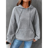Textured pink waffle knit hoodie for women, styled in a cozy winter pullover design, displayed in a gray color and size 3XL, laid on a flat surface.