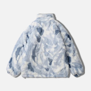 Trendy abstract design fleece jacket featuring a blue cloud artistic print, with long sleeves and a stylish collar. The jacket is made from natural materials and showcases a unique pattern in electric blue, resembling a fashionable top.
