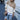 Trendy beige turtleneck sweater with striped sleeves, shown in khaki color and size XL, featuring a close-up of the sweater's shoulder and neck details.