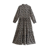Boho chic fall fashion maxi dress with trendy geometric print, long sleeves, and a stylish day dress design.