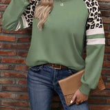 Trendy Leopard Print Sleeve Green Pullover featuring contrasting leopard print sleeves, a comfortable neckline, and a stylish streetwear design for women.