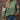Women's streetwear top with a trendy leopard print sleeve and green pullover design, paired with jeans, showcasing a fashionable look.